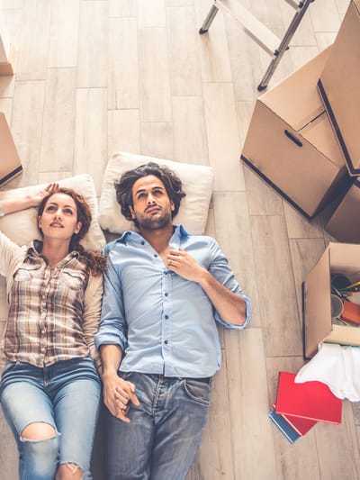 A couple moving out of their house representing rv travel trends 2026